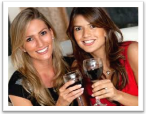 Two women enjoying free wine